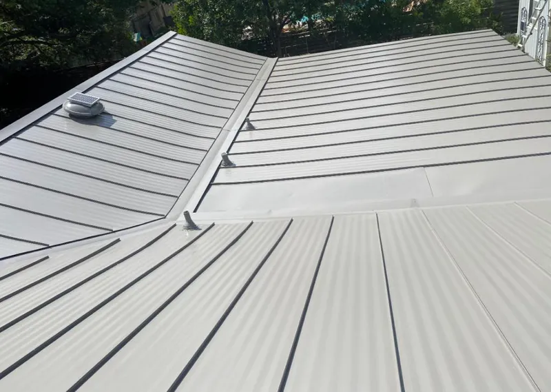 Solar attic fan installed on a metal roof for Roof Ventilation in La Marque